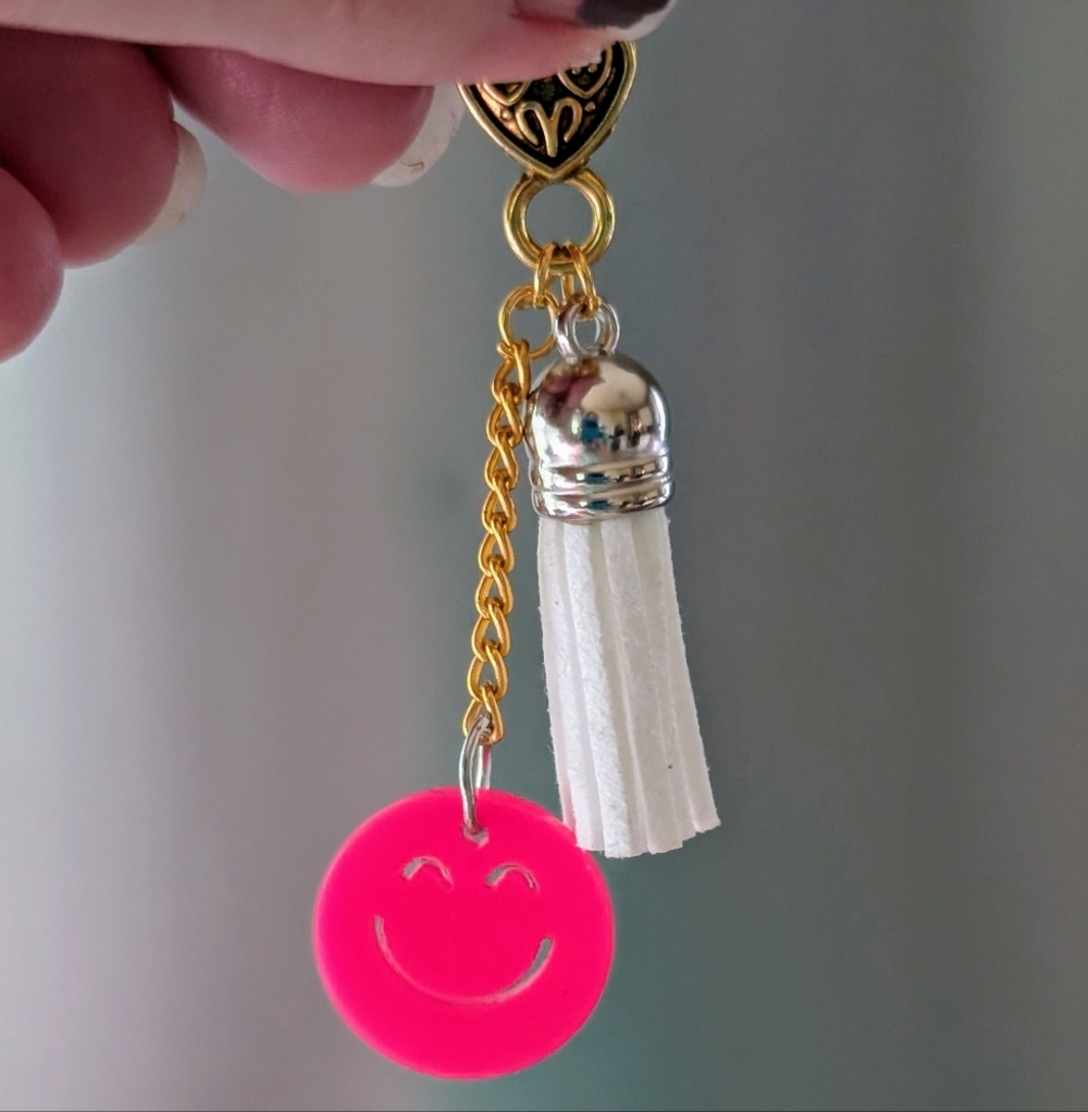 Gold and Pink Smiley Bag Charm with White Tassel